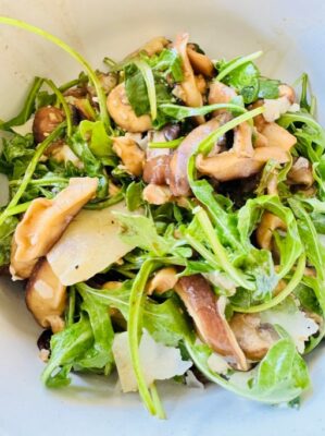 Wild Mushroom Salad with Shaved Manchego over Baby Arugula